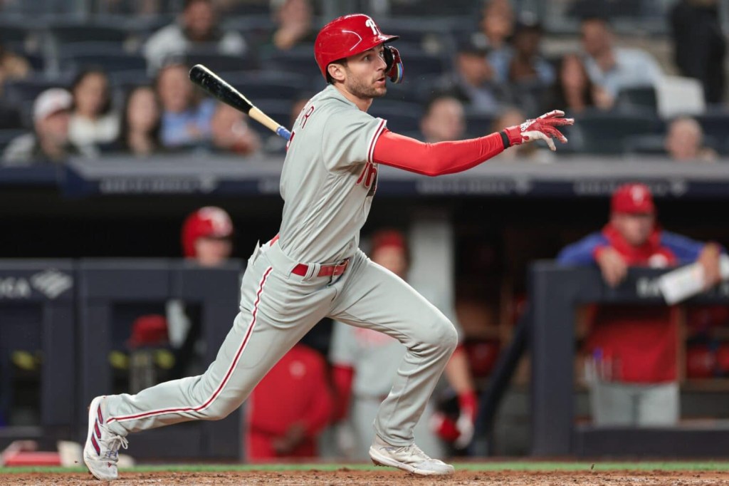Philadelphia Phillies shortstop Trea Turner (7) hits an hits an RBI single during the fifth inning against the New York Yankees at Yankee Stadium.