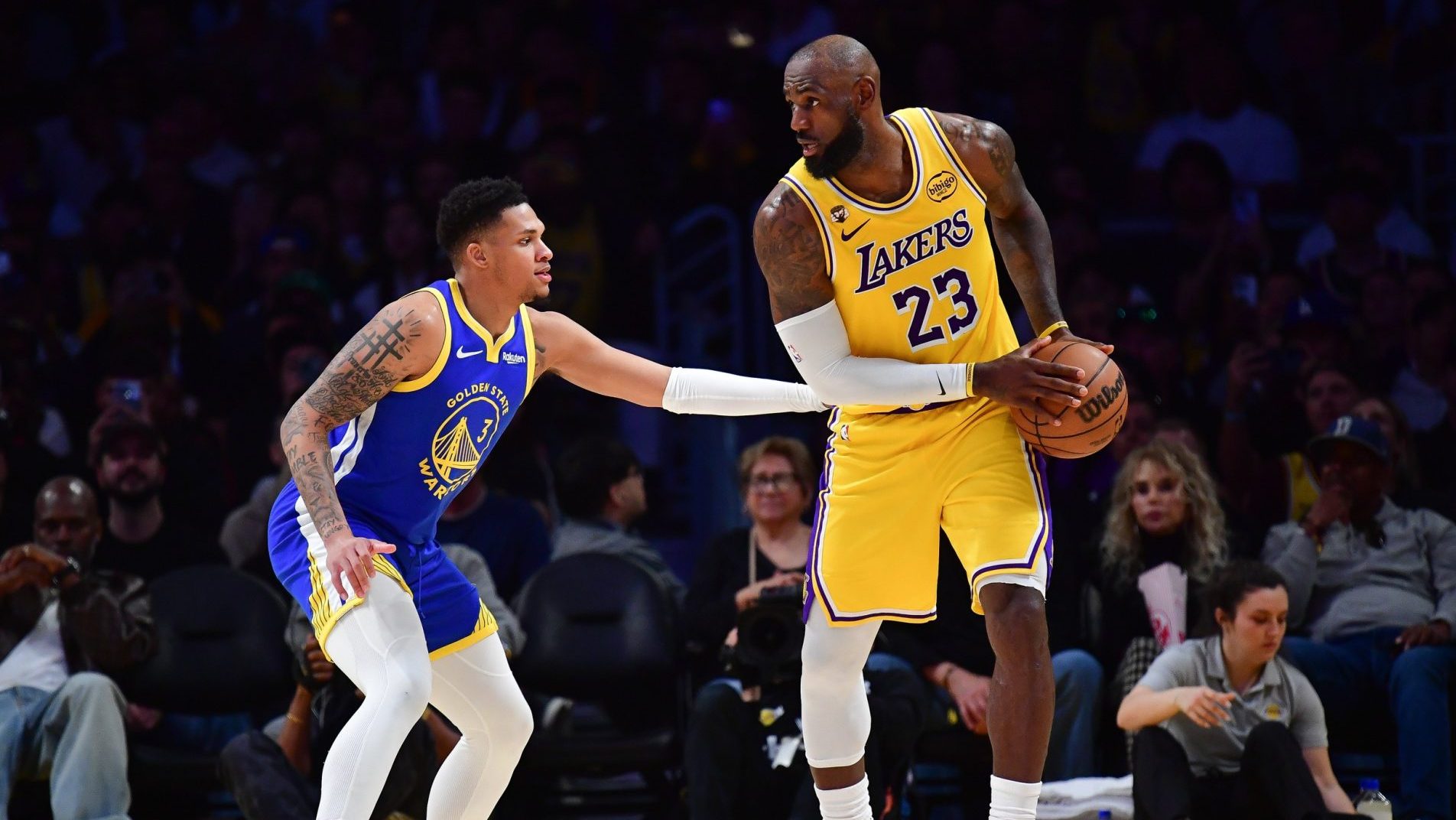 Feb 7, 2026; Los Angeles, California, USA; Los Angeles Lakers forward LeBron James (23) controls the ball against Golden State Warriors guard Will Richard (3) during the second half at Crypto.com Arena.