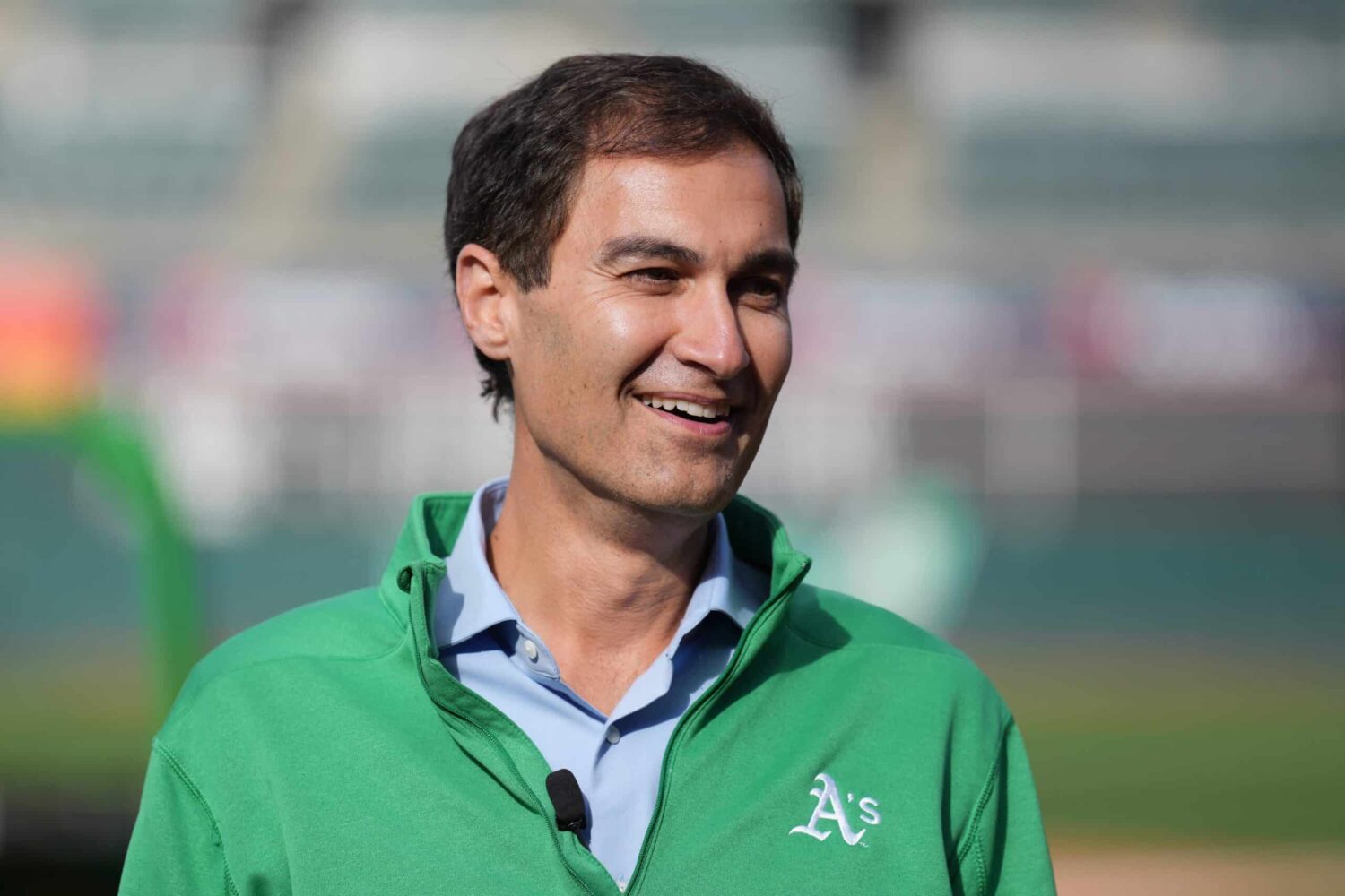 Oakland Athletics president Dave Kaval talks on the field before the game against the Minnesota Twins at RingCentral Coliseum.