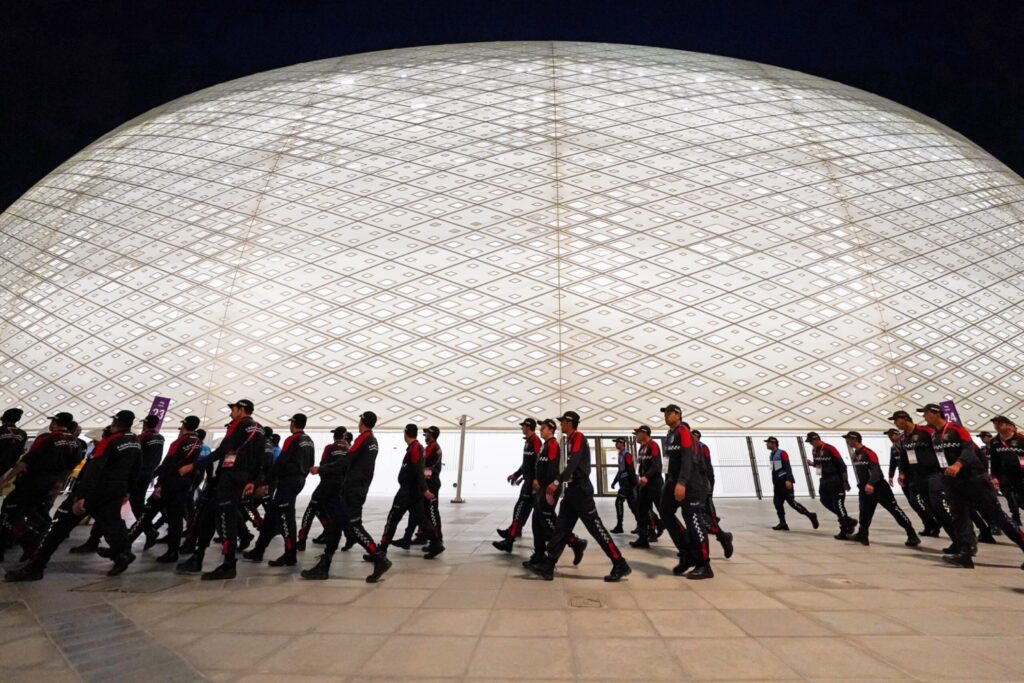 Security personnel walk on the concourse before a group stage match between the United States of America and Iran during the 2022 World Cup at Al Thumama Stadium.