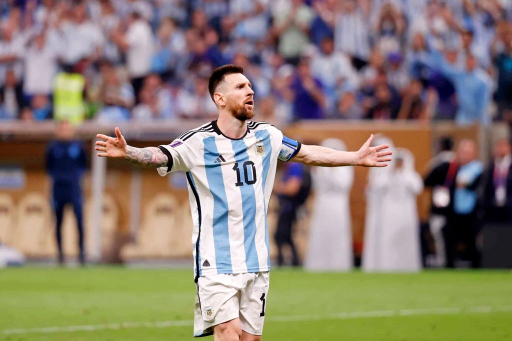 Argentina forward Lionel Messi reacts after making his shot during a penalty shootout in the 2022 World Cup final.