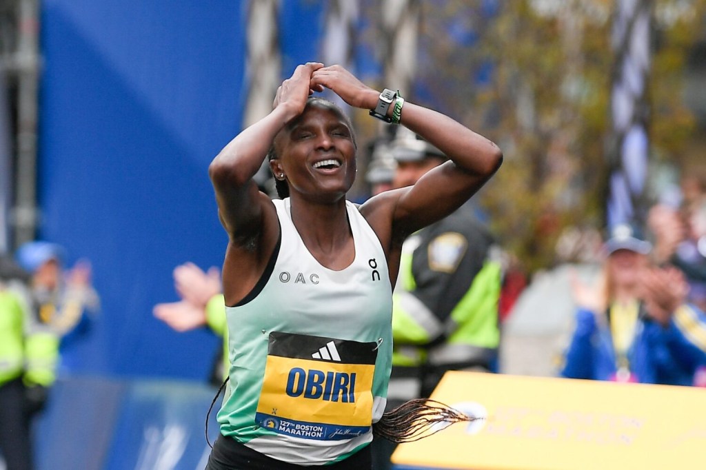 Hellen Obiri of Kenya crosses the finish line to win the women's division at the 2023 Boston Marathon.
