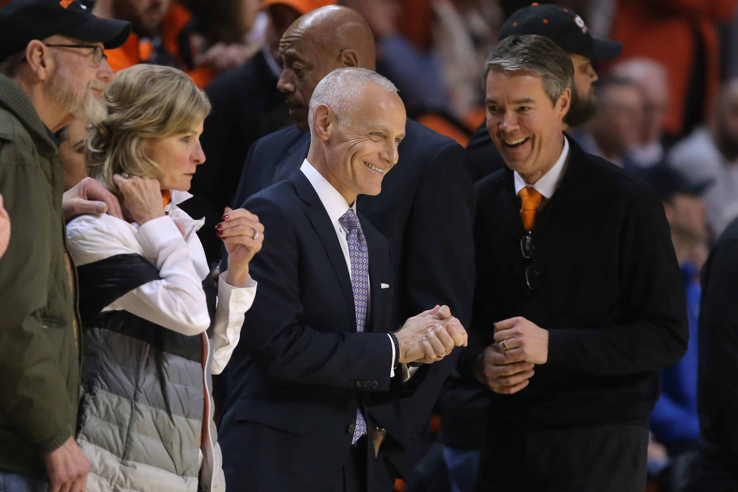 Big 12 commissioner Brett Yormark, center, and Oklahoma State athletic director Chad Weiberg, right, before a men's college basketball game between the Oklahoma State University Cowboys and the Kansas Jayhawks at Gallagher-Iba Arena in Stillwater, Okla., Tuesday, Feb. 14, 2023.