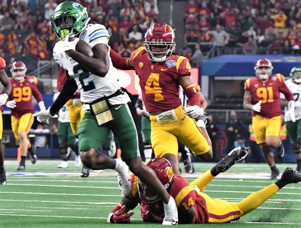 Tulane's Dorian Williams breaks a tackle from USC's Jacobe Covington during the 87th Goodyear Cotton Bowl Classic at AT&T Stadium on Monday, January 2, 2023.