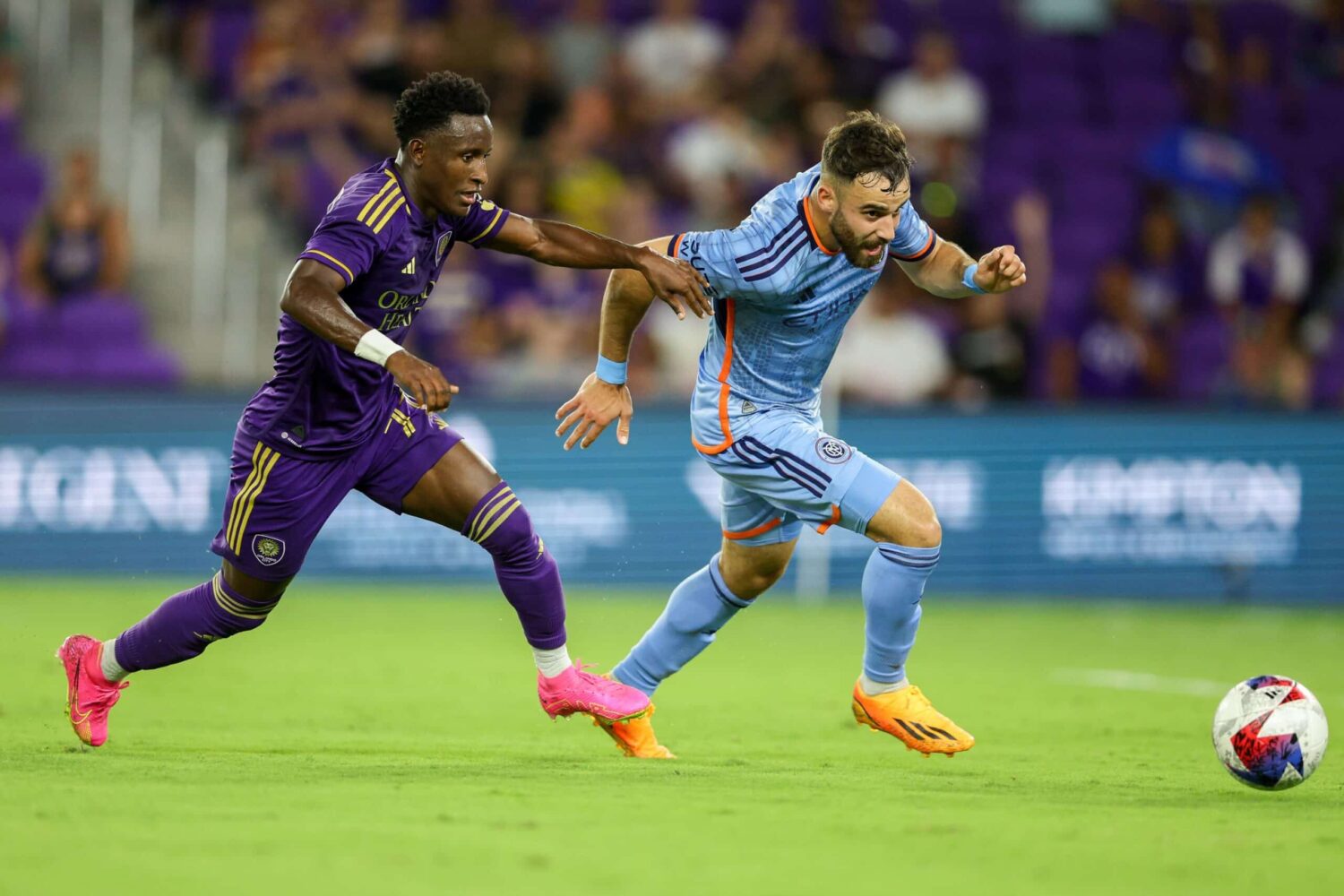 New York City FC forward Kevin O'Toole (22) controls the ball from Orlando City SC forward Ivan Angulo (77) in the second half at Exploria Stadium.