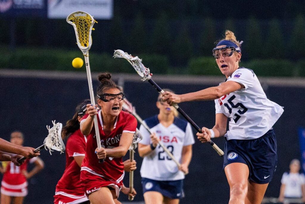 A USA women's lacrosse player shoots in a game against Hong Kong.