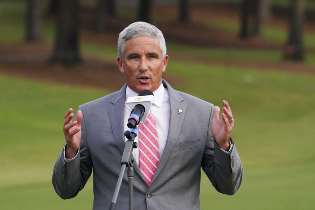 PGA Tour commissioner Jay Monahan talks into a microphone at the 2022 Presidents Cup.