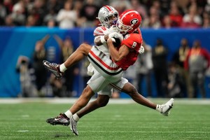 Georgia Bulldogs wide receiver Dominick Blaylock (8) catches a pass while being defended by Ohio State Buckeyes safety Jaylen Johnson (25) during the first half of the Peach Bowl.