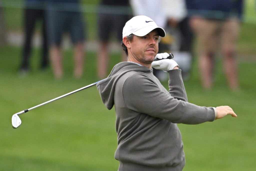 Rory McIlroy reacts to a shot at the 17th hole during the first round of the RBC Canadian Open golf tournament.