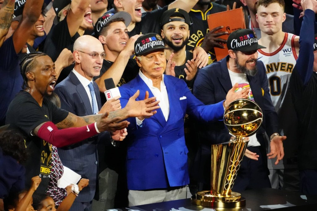 Jun 12, 2023; Denver, Colorado, USA; NBA commissioner Adam Silver presents the Larry O'Brien Trophy to Denver Nuggets owner Stan Kroenke after the Nuggets won the 2023 NBA Championship against the Miami Heat at Ball Arena.