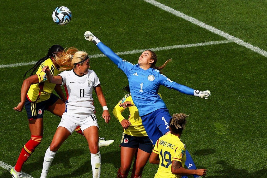 Colombia's goalkeeper punches the ball away during a match with South Korea at the 2023 FIFA Women's World Cup.