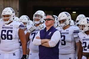 Oct 29, 2022; Iowa City, Iowa, USA; Northwestern head coach Pat Fitzgerald and the Wildcats team before the game against the Iowa Hawkeyes at Kinnick Stadium.