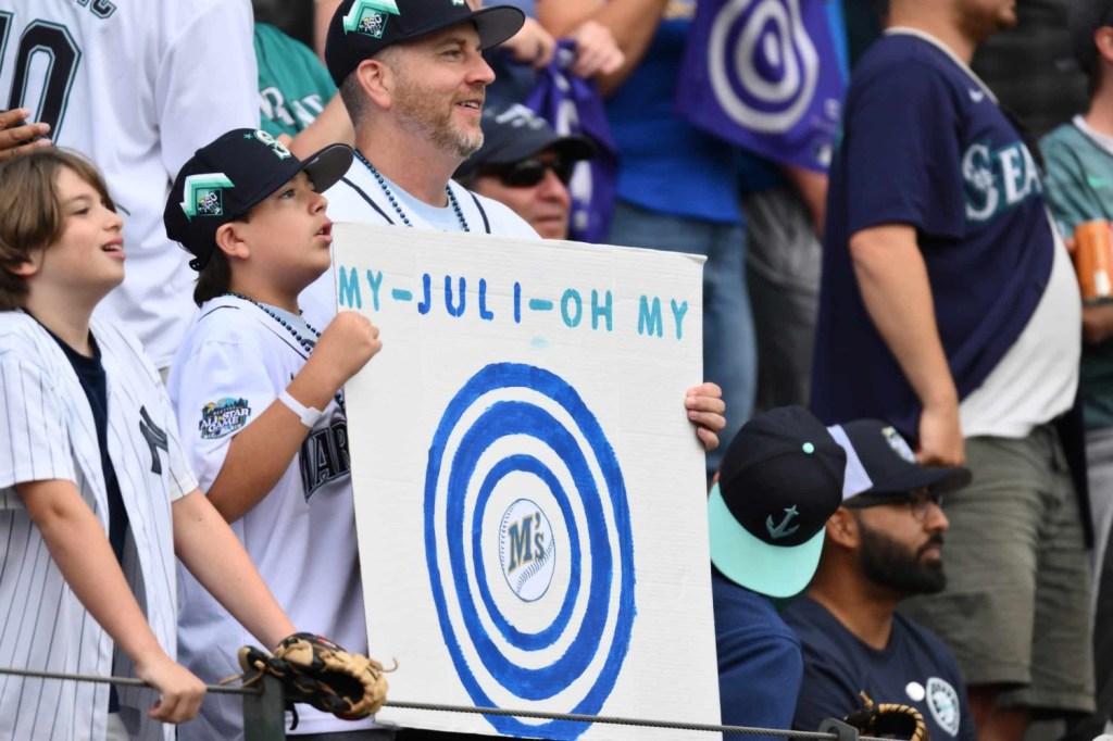 A young fan holds a sign for Julio Rodriguez during the 2023 MLB Home Run Derby.