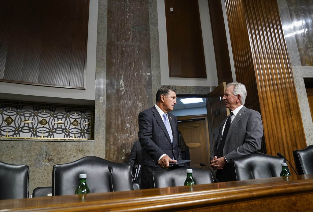 Jul 11, 2023; Washington, DC, USA; Senator Joe Manchin (D-WV), left, and Sen. Tommy Tuberville (R-Ala.) speaking.