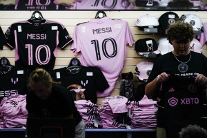 Lionel Messi merchandise seen before the Inter Miami FC forward is introduced at The Unveil event and press conference at DRV PNK Stadium.