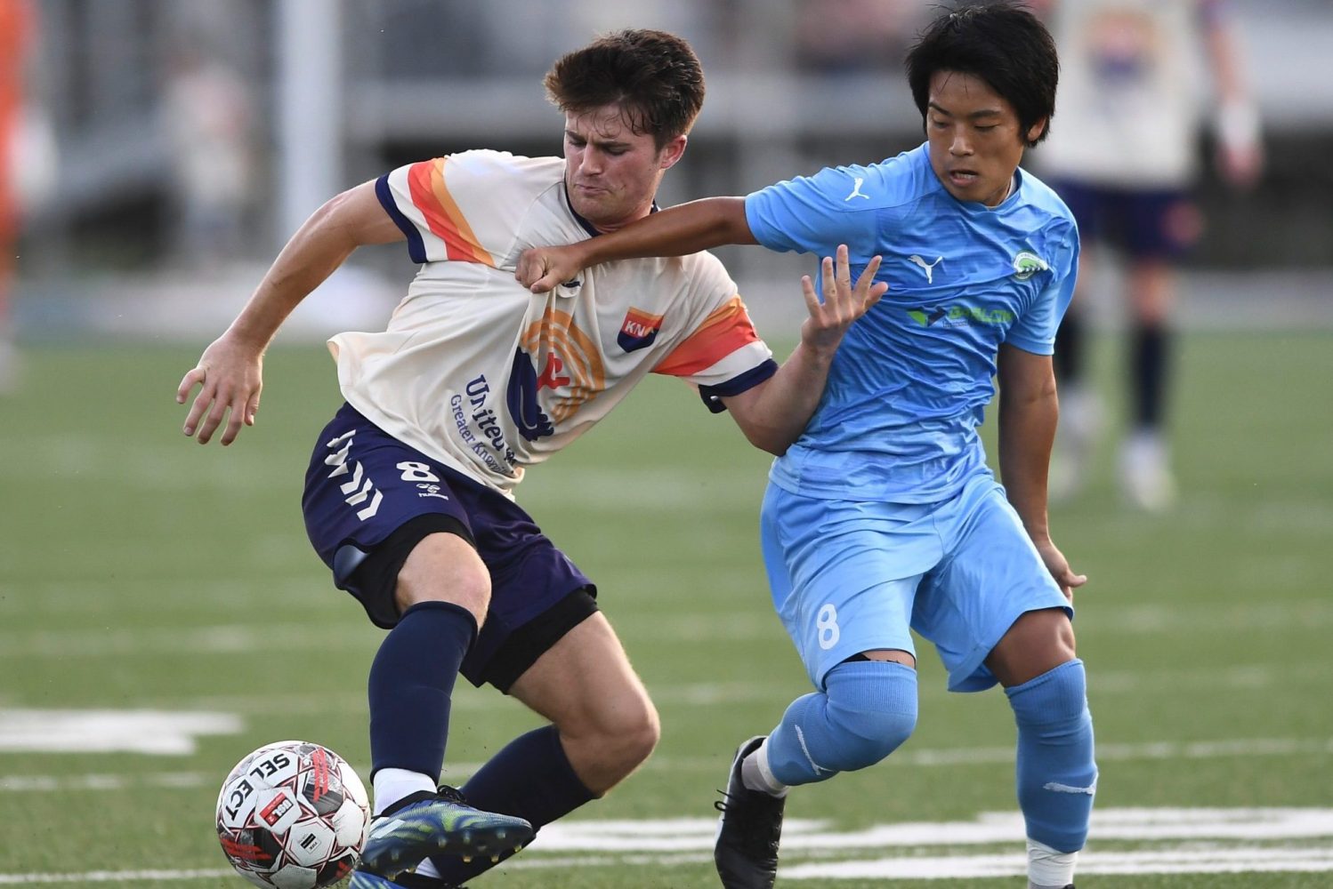One Knoxville SC's Sam Fletcher tries to protect the ball from West Virginia United's Harei Maeda during the regional final soccer match of the USL League Two playoffs in 2022.