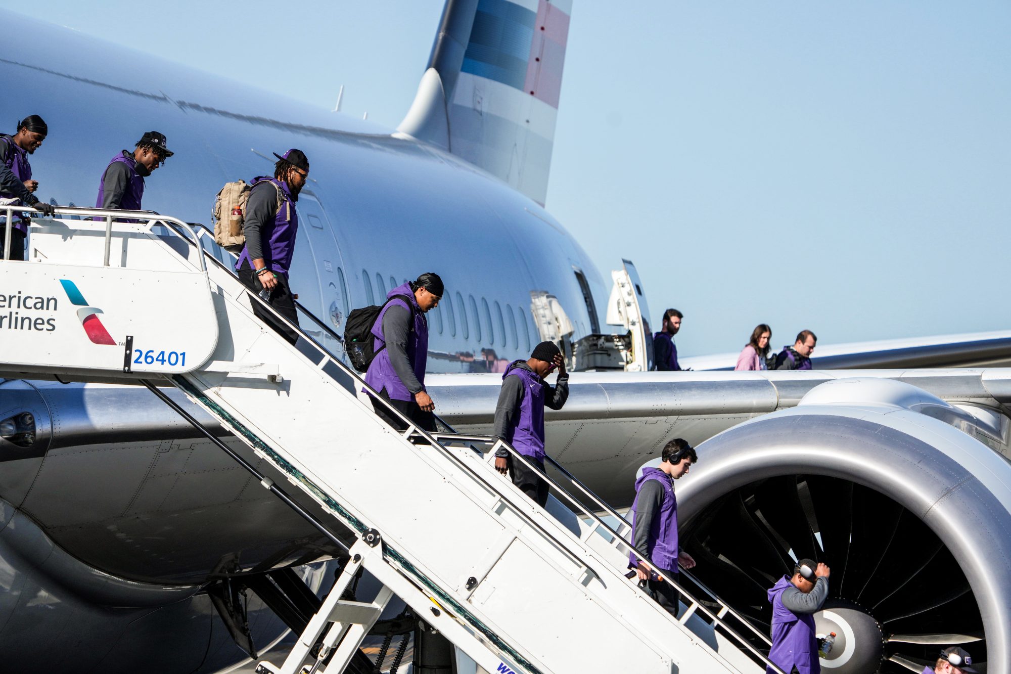 Jan 6, 2023; Los Angeles, California, USA; TCU Horned Frogs players disembark an American Airlines plane after arriving at Los Angeles International Airport prior to the College Football National Championship.