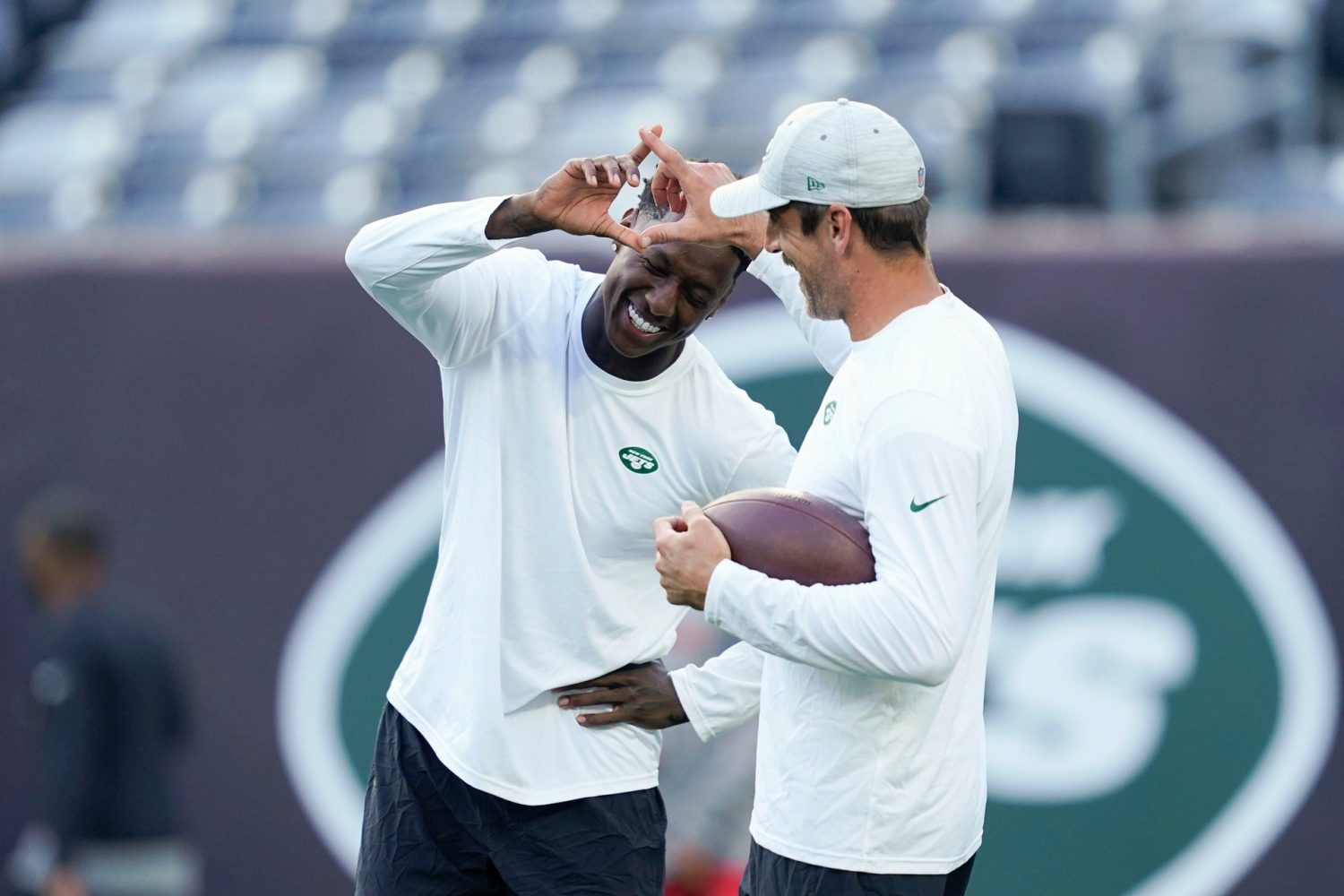 New York Jets cornerback Sauce Gardner, left, and quarterback Aaron Rodgers perform their handshake before a preseason NFL game at MetLife Stadium on Saturday, Aug. 19, 2023, in East Rutherford.