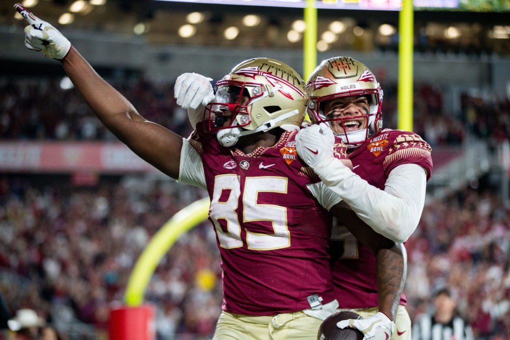 Florida State Seminoles tight end Markeston Douglas (85) and his teammate celebrate a touchdown. The Florida State Seminoles defeated the Oklahoma Sooners 35-32 in the Cheez-It Bowl at Camping World Stadium on Thursday, Dec. 29, 2022.