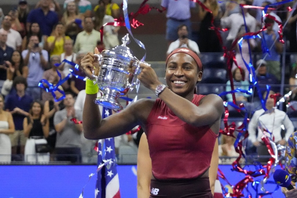 Coco Gauff of the United States celebrates with the championship trophy after her match against Aryna Sabalenka in the women's singles final on day thirteen of the 2023 U.S. Open tennis tournament at USTA Billie Jean King Tennis Center.