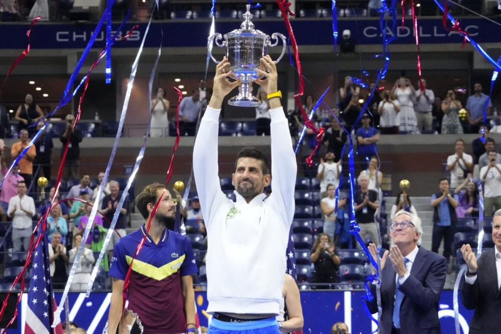 Novak Djokovic of Serbia celebrates with the championship trophy after his match against Daniil Medvedev in the men's singles final on day fourteen of the 2023 U.S. Open tennis tournament at USTA Billie Jean King National Tennis Center.