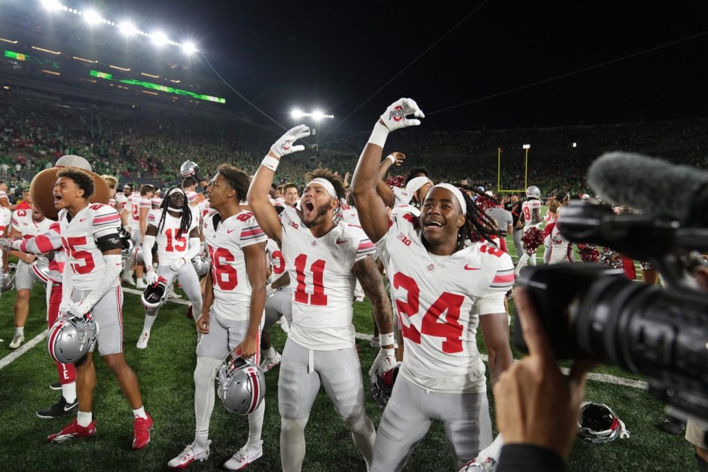 Ohio State players celebrate after after their defeat of Notre Dame in the final seconds at Notre Dame Stadium.
