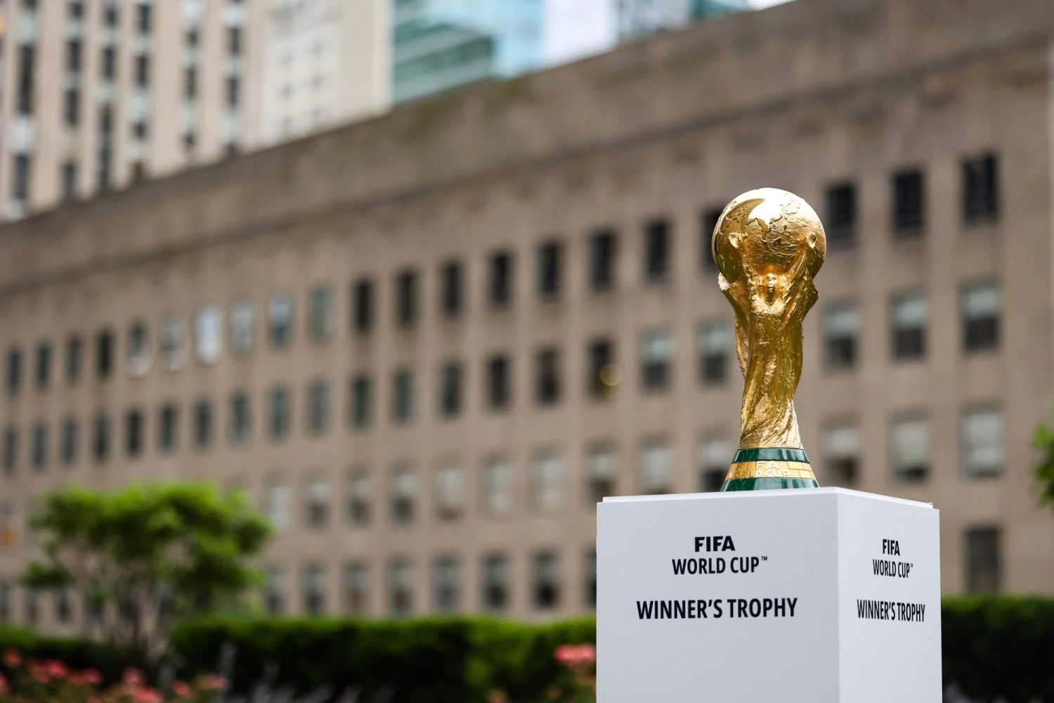 The FIFA World Cup Trophy sits on a stand outside of 30 Rockefeller Plaza.