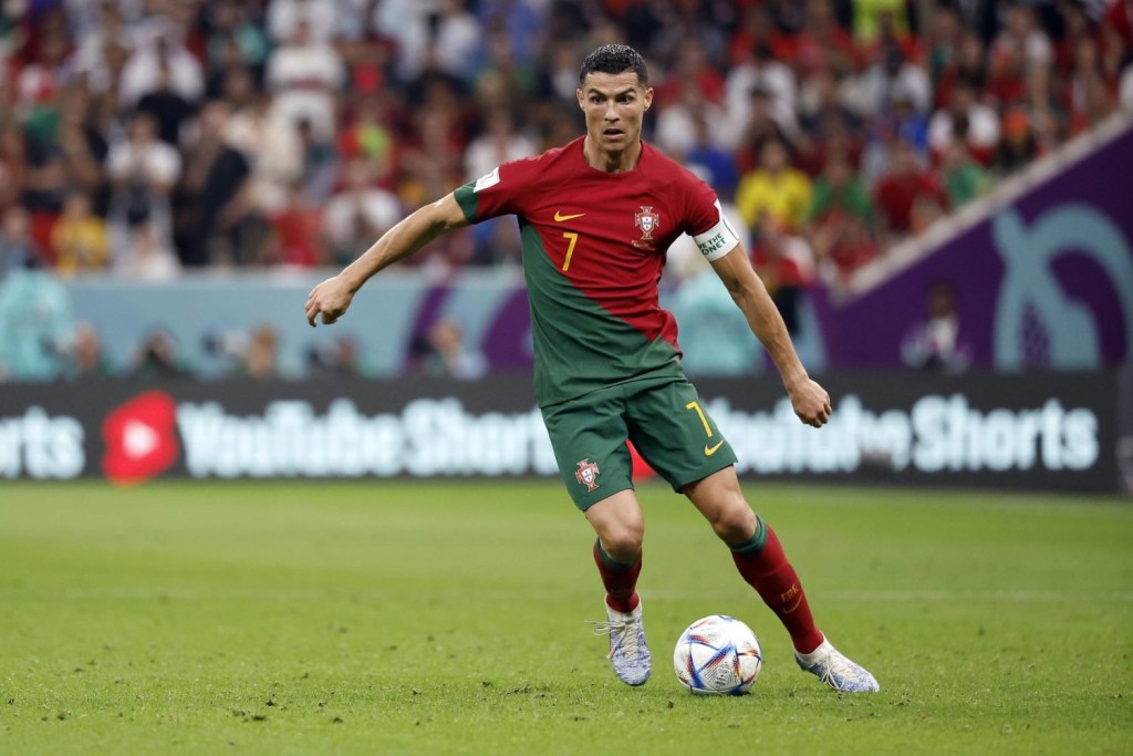 Portugal forward Cristiano Ronaldo moves the ball against Uruguay during the second half of the group stage match in the 2022 World Cup at Lusail Stadium.
