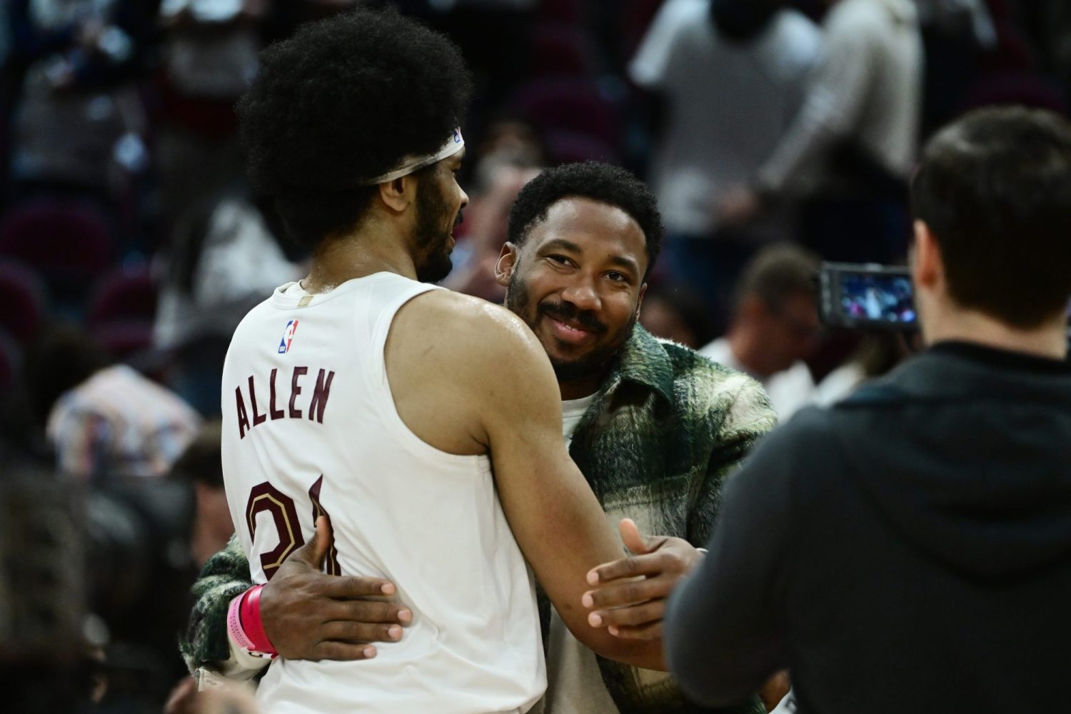 Cleveland Cavaliers center Jarrett Allen hugs Cleveland Browns player Myles Garrett after the Cavaliers beat the New York Knicks in game two of the 2023 NBA playoffs at Rocket Mortgage FieldHouse.