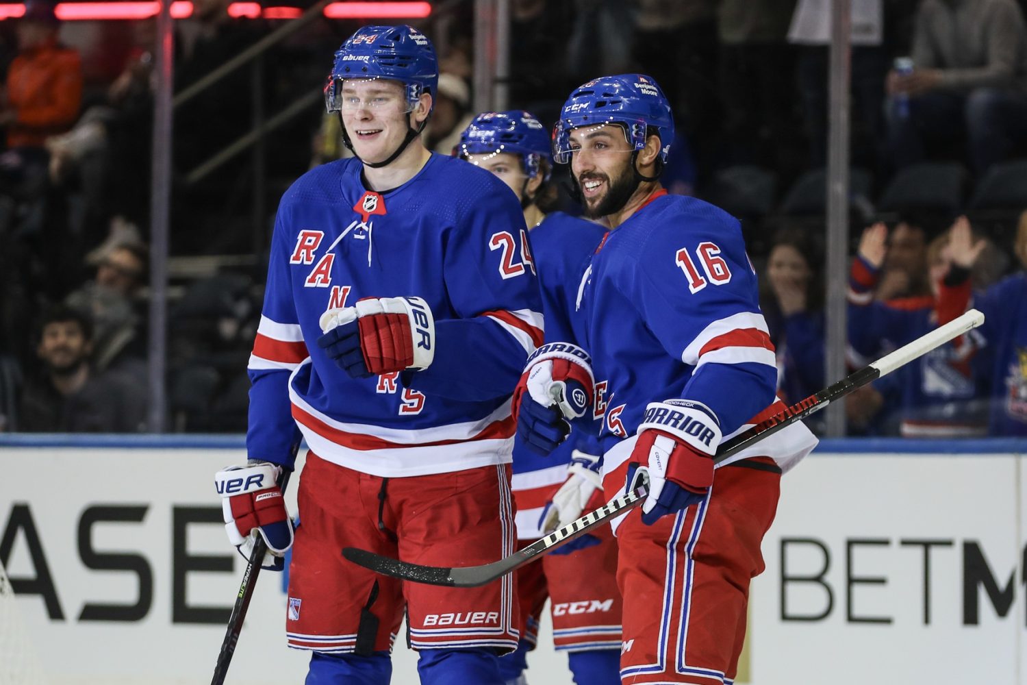 New York Rangers right wing Kaapo Kakko (24) celebrates with his teammates after scoring a goal in the first period against the New York Islanders at Madison Square Garden.