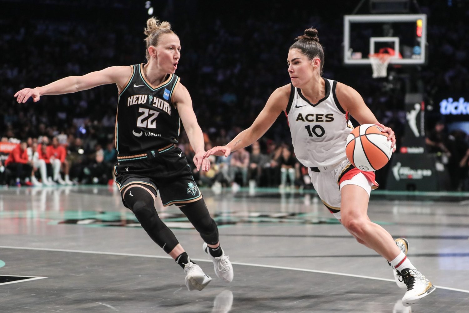 Las Vegas Aces guard Kelsey Plum is defended by New York Liberty guard Courtney Vandersloot in the second quarter during game three of the 2023 WNBA Finals at Barclays Center.