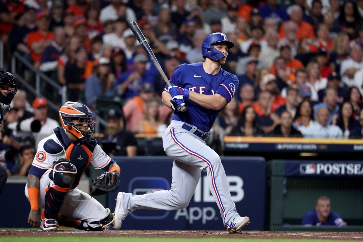 Texas Rangers shortstop Corey Seager singles during the first inning of game one of the ALCS against the Houston Astros in the 2023 MLB playoffs at Minute Maid Park.