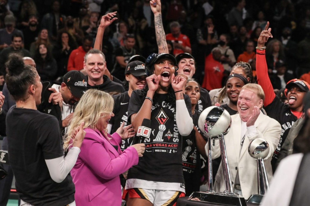 The Las Vegas Aces celebrate after defeating the New York Liberty to win the 2023 WNBA Finals at Barclays Center.