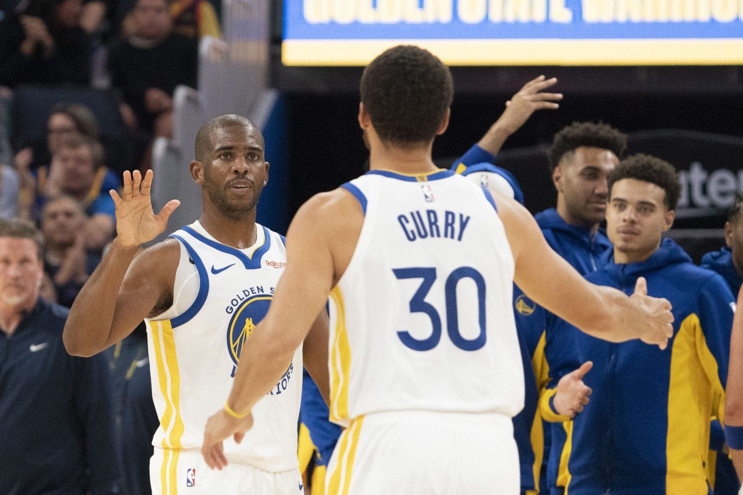 Golden State Warriors guard Chris Paul and guard Stephen Curry celebrate against the San Antonio Spurs during the second quarter at Chase Center.