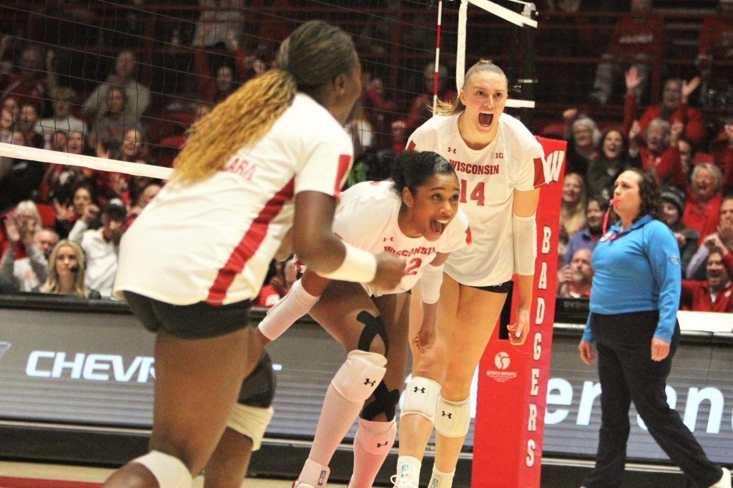 Wisconsin middle blocker Carter Booth celebrates with Anna Smrek and Temi Thomas-Ailara during a match with Minnesota on Sunday Oct. 29, 2023 at the UW Field House in Madison, Wisconsin.