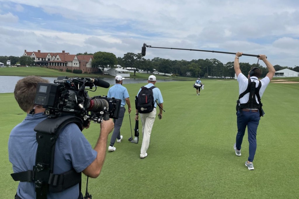 A view of Netflix camera crews filming a golfer for its series "Full Swing."