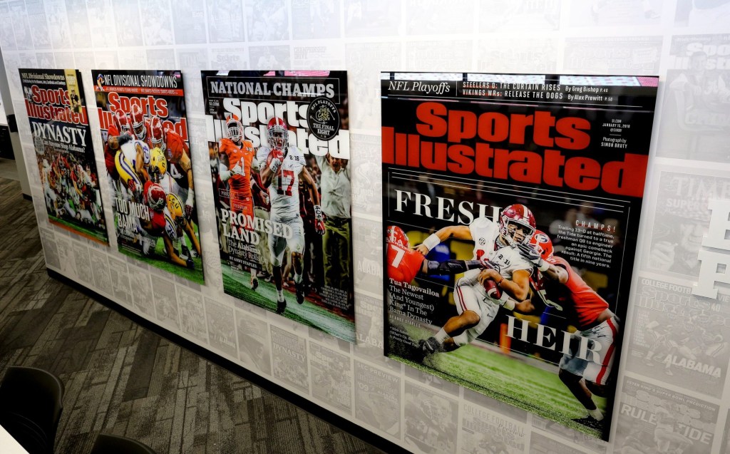 Sports Illustrated covers decorate the walls inside the new press box.