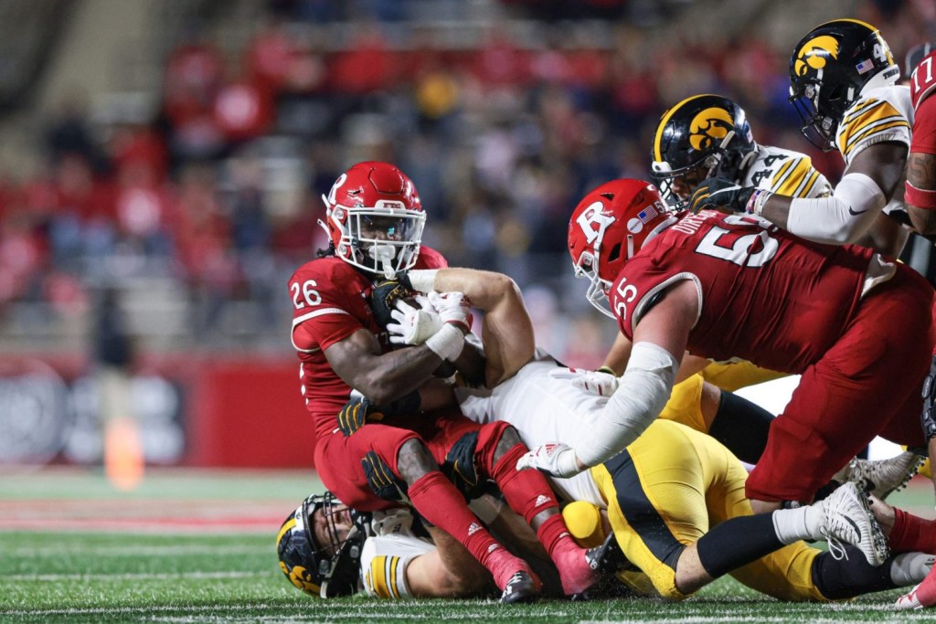 Rutgers Scarlet Knights running back Kaevon Merriweather is tackled by Iowa Hawkeyes defensive back Gaven Cooke during the second half at SHI Stadium.