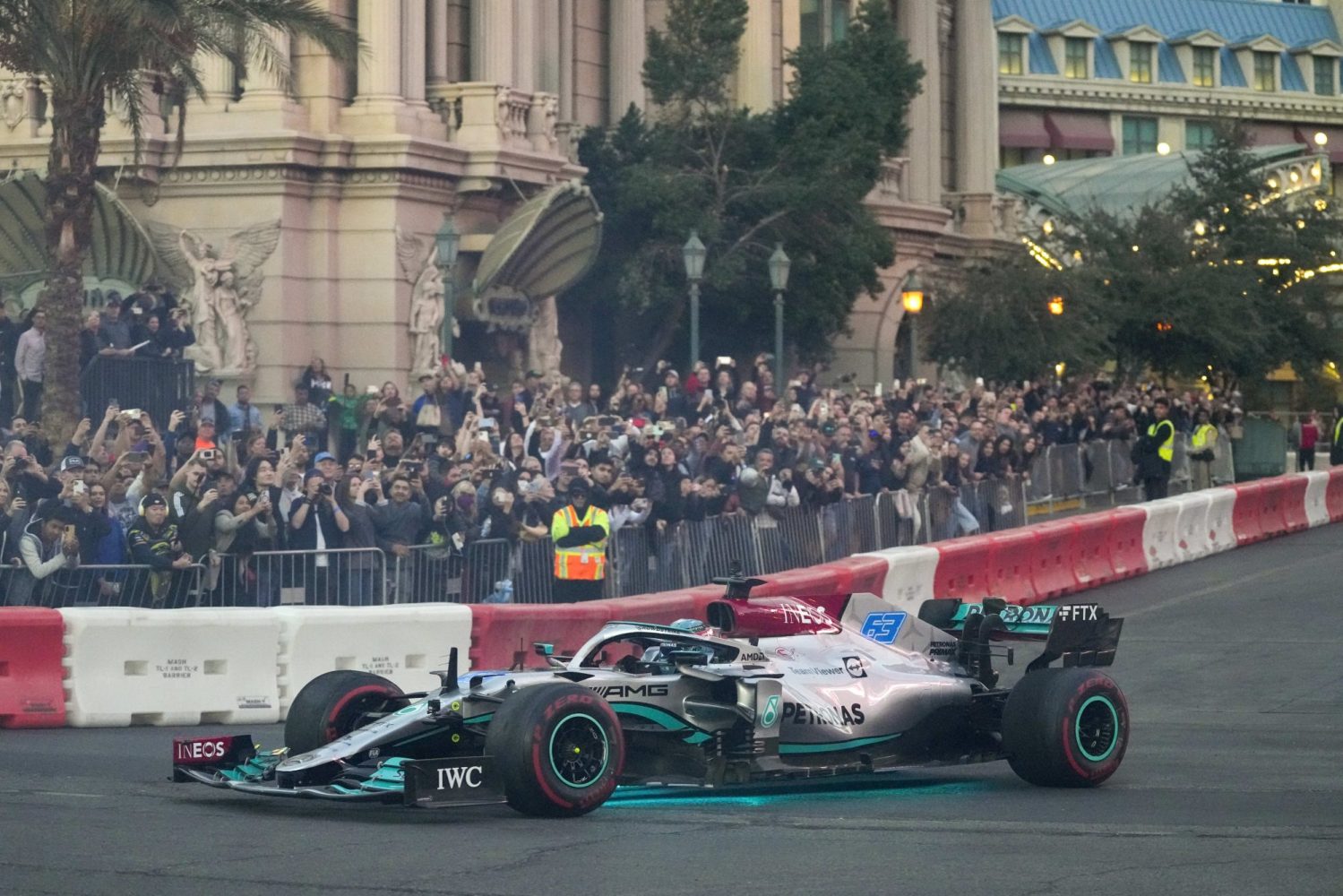 Mercedes-AMG Petronas driver George Russell drives in front of race fans during the Formula One Las Vegas Grand Prix Launch Party at Las Vegas Strip.