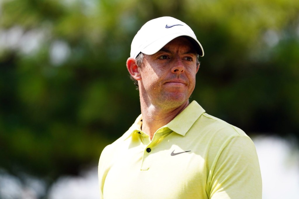 Rory McIlroy reacts to his putt on the third green during the third round of the TOUR Championship golf tournament at East Lake Golf Club.