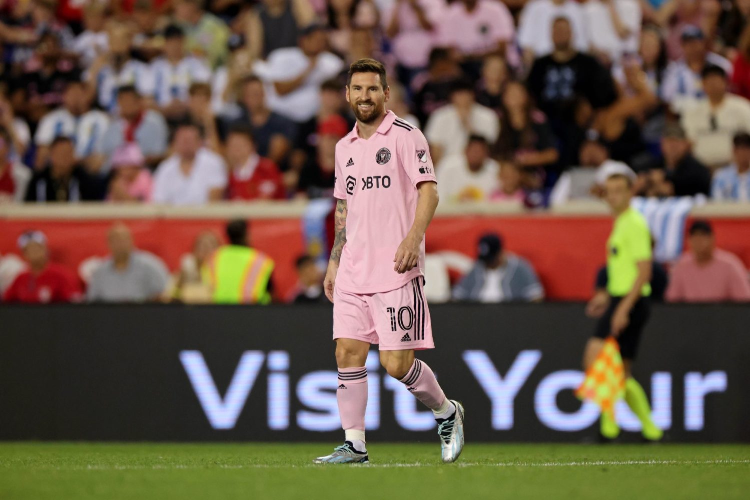 Inter Miami CF forward Lionel Messi smiles as he walks on the field against the New York Red Bulls during the second half at Red Bull Arena.