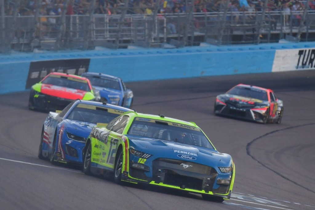 NASCAR Cup Series driver Ryan Blaney leads driver Kyle Larson during the Cup Series Championship race at Phoenix Raceway.