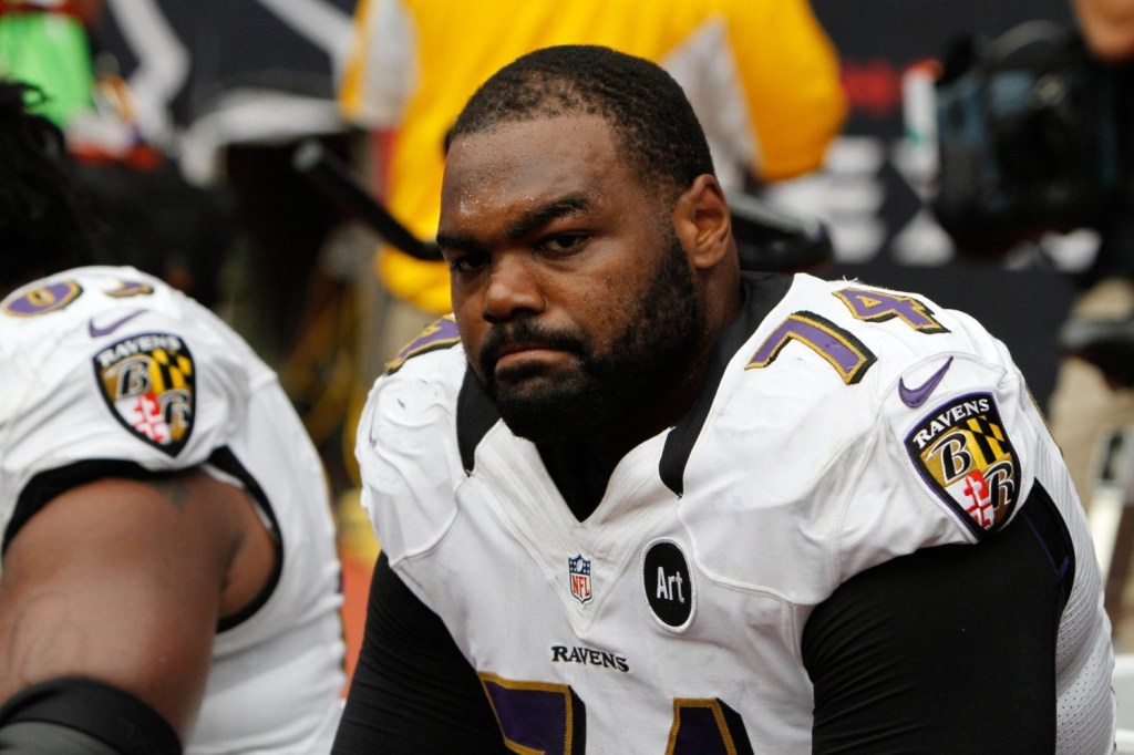Baltimore Ravens offensive tackle Michael Oher on the bench against the Houston Texans in the fourth quarter at Reliant Stadium. The Texans defeated the Ravens 43-13.