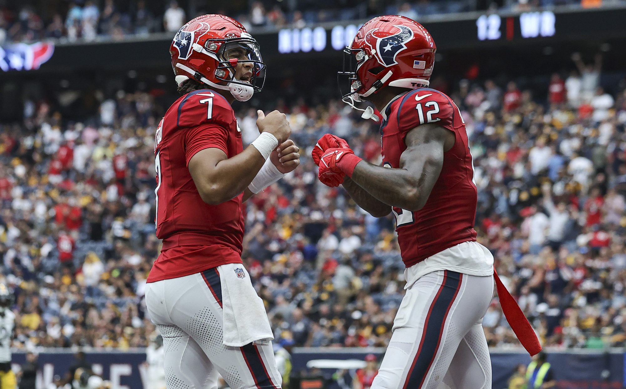 Oct 1, 2023; Houston, Texas, USA; Houston Texans quarterback C.J. Stroud (7) celebrates with wide receiver Nico Collins (12) after a touchdown during the game against the Pittsburgh Steelers at NRG Stadium.