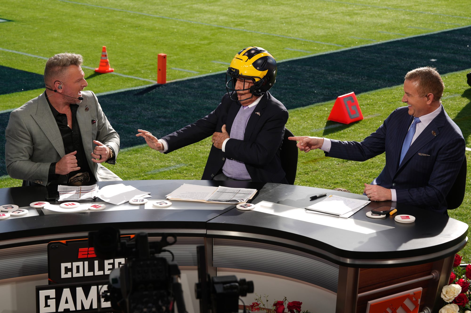 Jan 1, 2024; Pasadena, CA, USA; Pat McAfee (left), Lee Corso (center) and Kirk Herbstreit on the ESPN College Gameday set at the 2024 Rose Bowl college football playoff semifinal game at Rose Bowl.