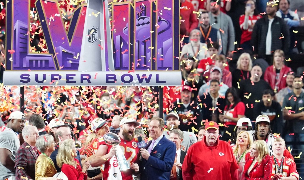 Feb 11, 2024; Paradise, Nevada, USA; Kansas City Chiefs tight end Travis Kelce (87) celebrates with the Vince Lombardi Trophy after defeating the San Francisco 49ers in Super Bowl LVIII at Allegiant Stadium.