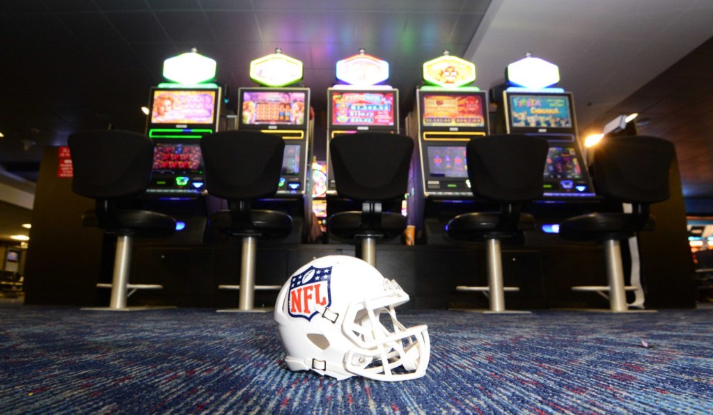 May 11, 2016; Las Vegas, NV, USA; General view of NFL shield logo helmet and slot machines at the McCarran International Airport. Raiders owner Mark Davis (not pictured) has pledged $500 million toward building a 65,000-seat domed stadium in Las Vegas at a total cost of $1.4 billion. NFL commissioner Roger Goodell (not pictured) said Davis can explore his options in Las Vegas but would require 24 of 32 owners to approve the move.