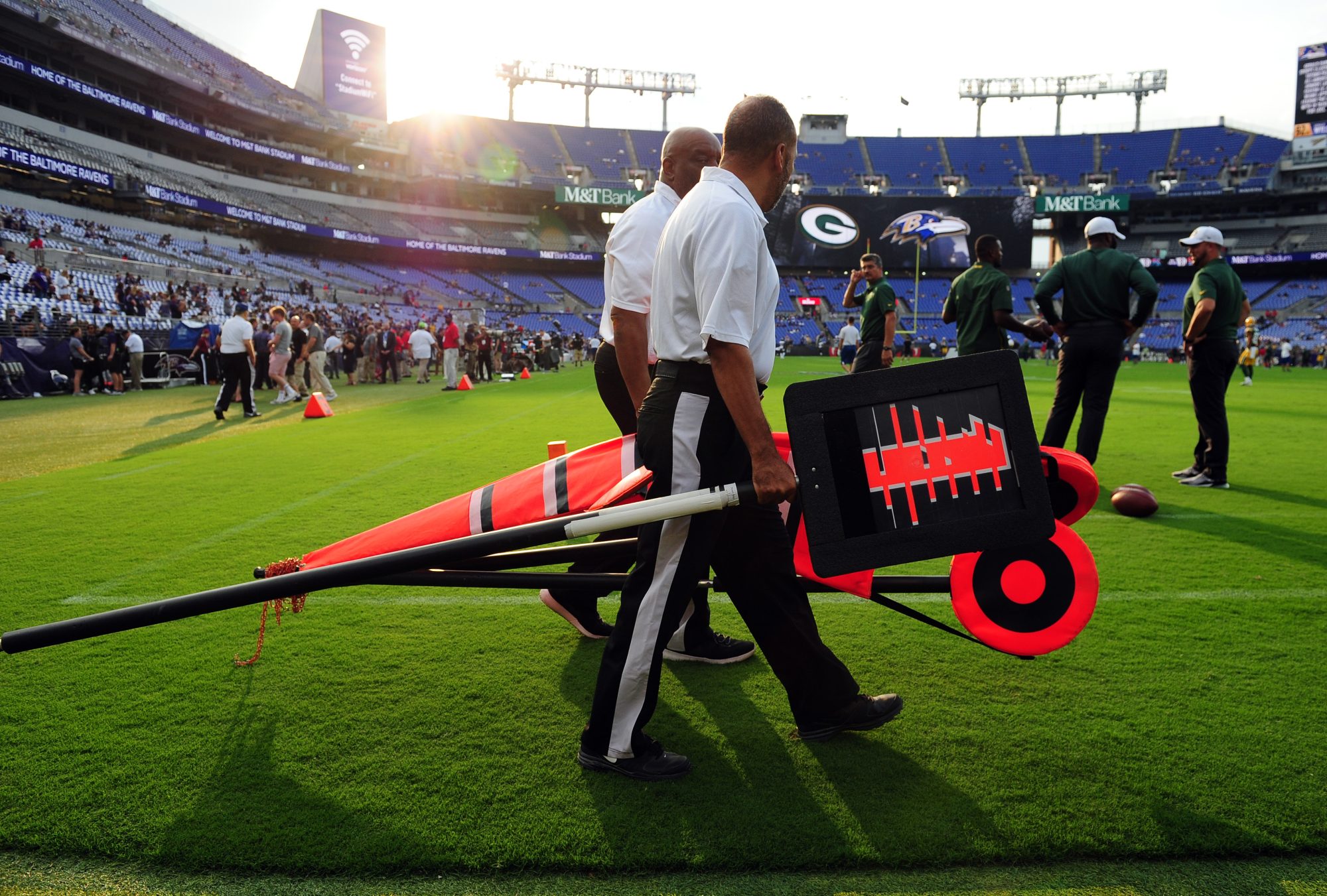 Aug 15, 2019; Baltimore, MD, USA; Chain crew members walk on the field prior to the game between the Green Bay Packers and Baltimore Ravens at M&T Bank Stadium.