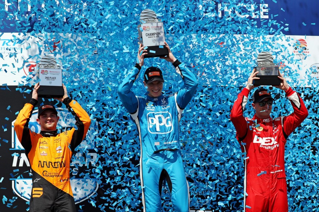 Mar 10, 2024; St. Petersburg, Florida, USA; Indycar driver Josef Newgarden (middle) celebrates winning the Grand Prix of St. Petersburg. Indycar driver Patricio O'Ward (left) celebrates winning second and Indycar driver Scott McLaughlin (right) celebrates winning third.