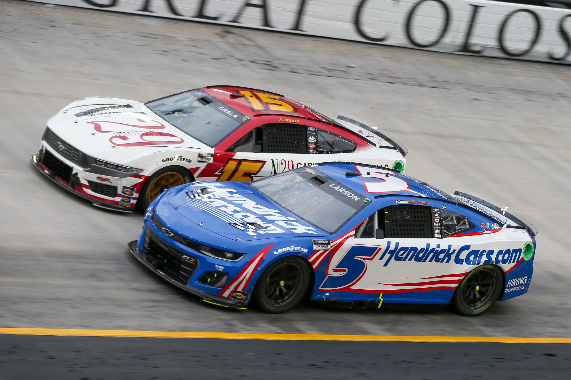 Mar 17, 2024; Bristol, Tennessee, USA; NASCAR Cup Series driver Kaz Grala (15) and driver Kyle Larson (5) during the Food City 500 at Bristol Motor Speedway. Mandatory Credit: Randy Sartin-USA TODAY Sports